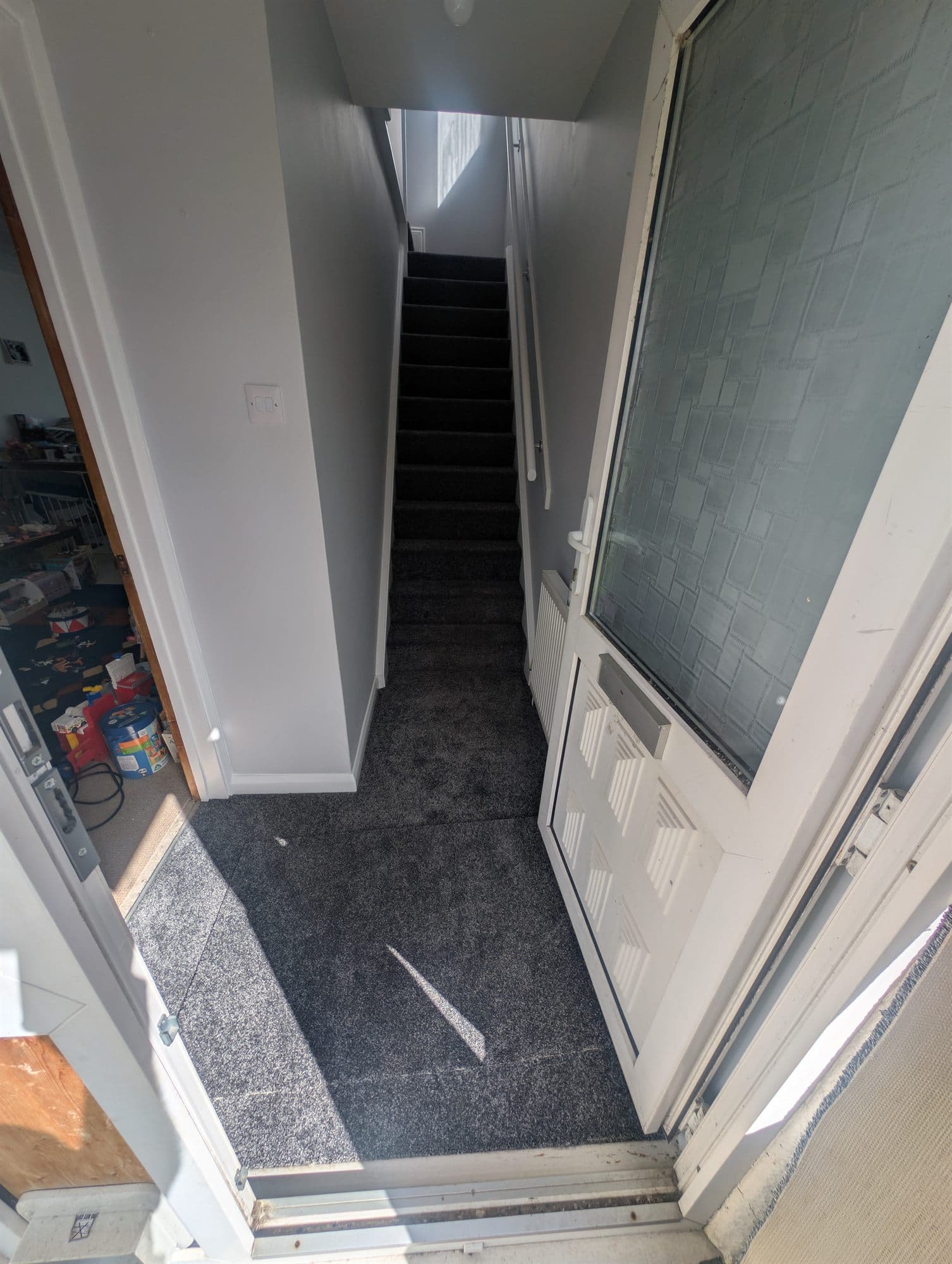 Entrance hall and stairs finished with grey carpet and freshly painted walls