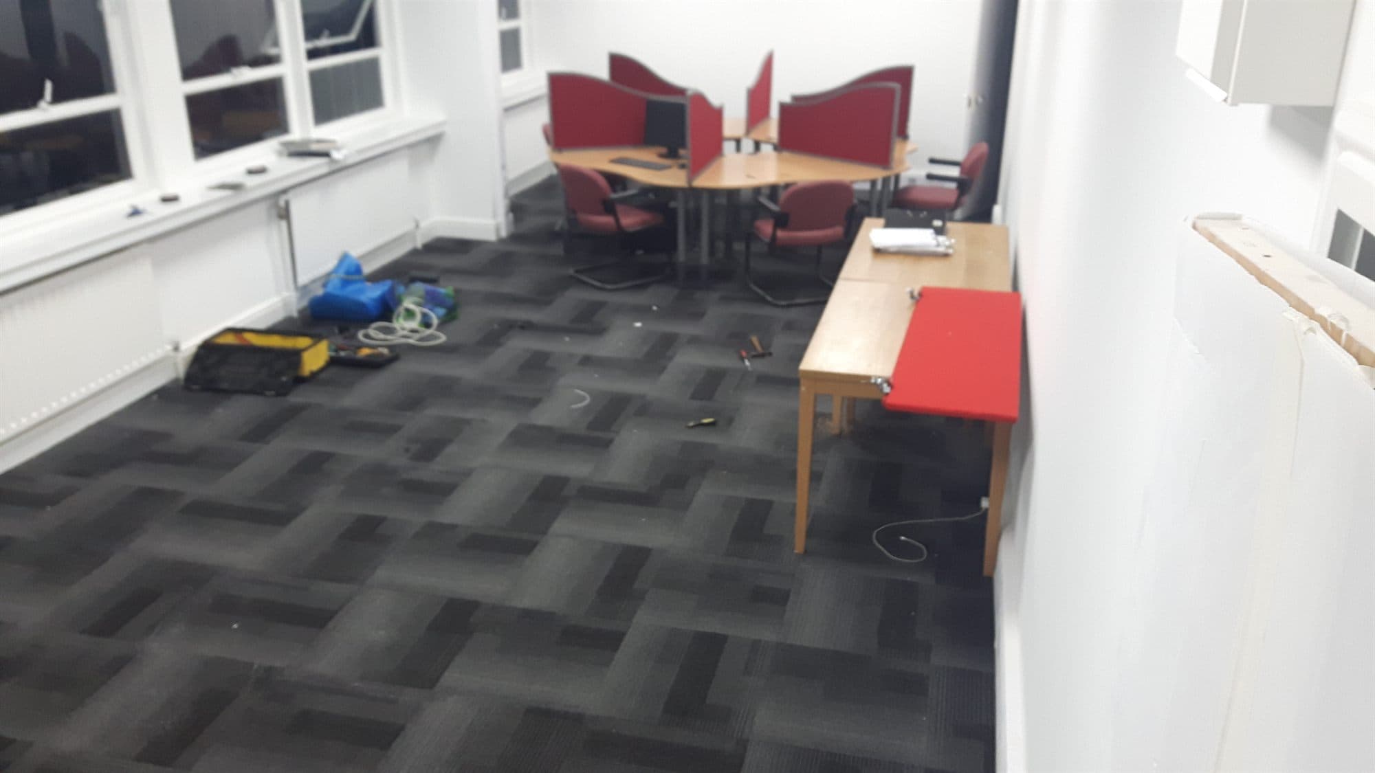 Office space finished with grey carpet tiles